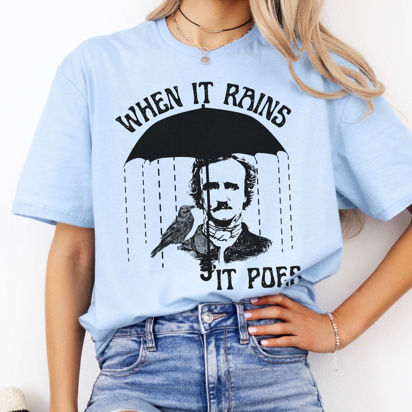 When It Rains It Poes Tee Light Blue / S T-Shirt The Mystic Eden Bookish Book Lovers